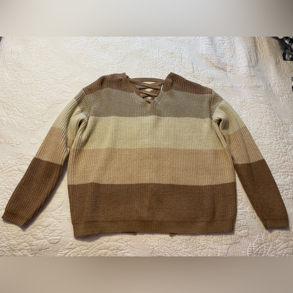 A sweater size M, from Rock and Roll Denim, colors are pastel pink, grey, brown.